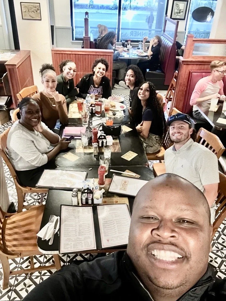 Christ Fellowship college students, young adults, and leaders sharing a meal together