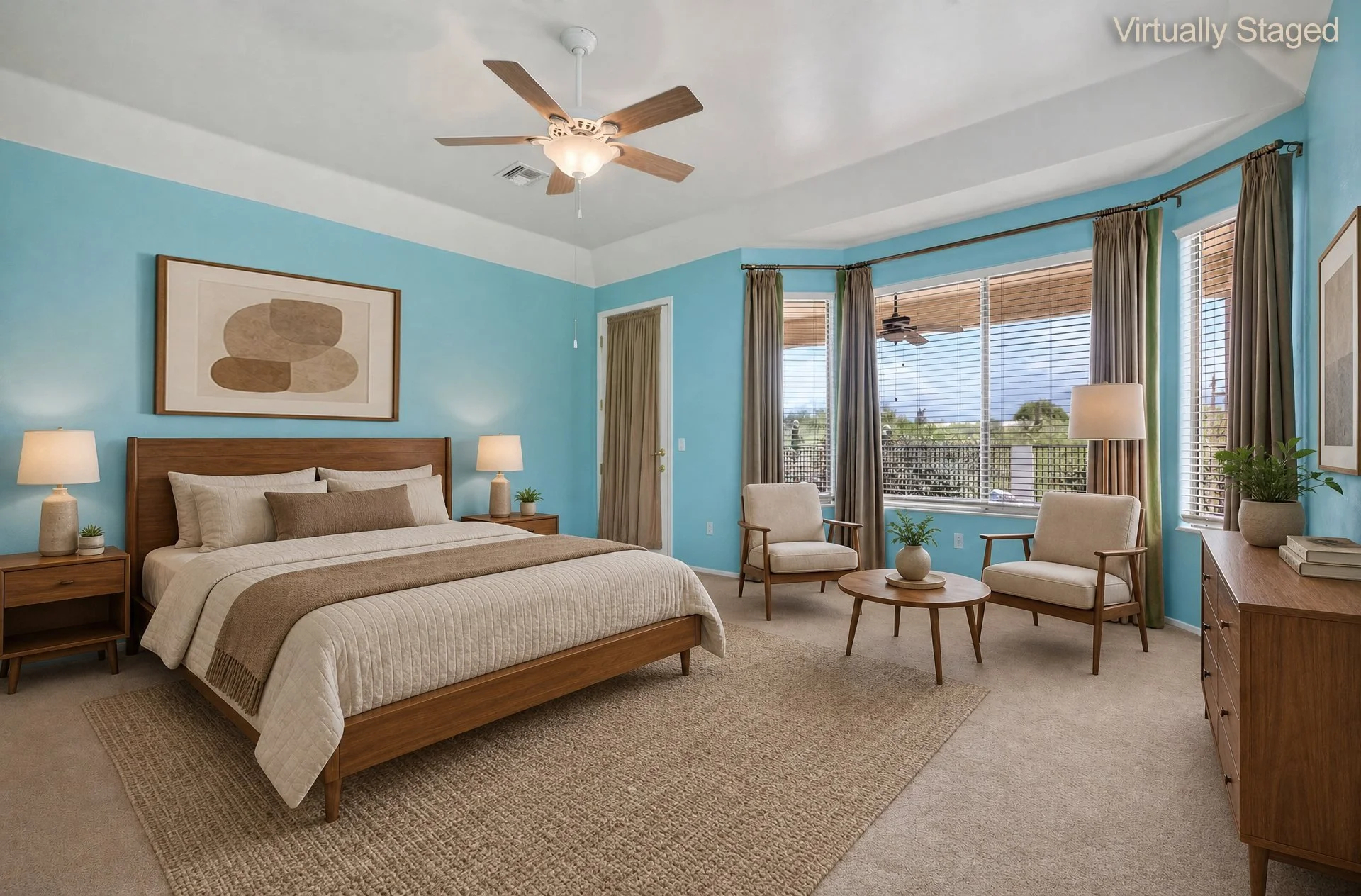 Virtually staged primary bedroom with high ceilings, ceiling fan and windows to the patio