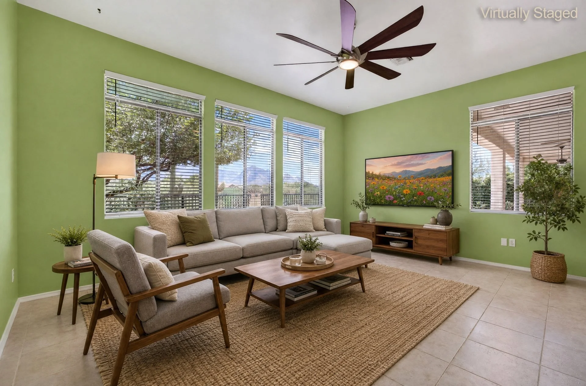 Virtually staged family room off the kitchen with three tall windows
