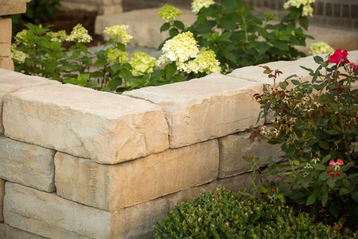 Kodah garden wall forming raised planting beds in a residential landscape