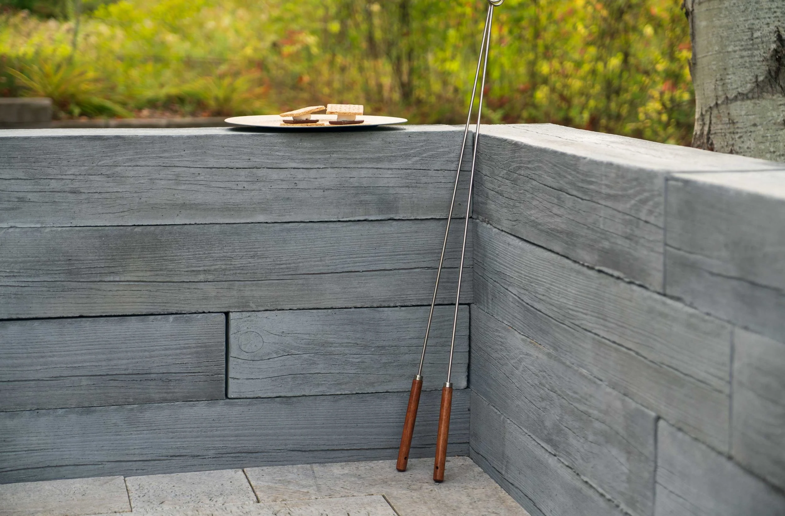 Heartwood freestanding wall defining an outdoor garden space