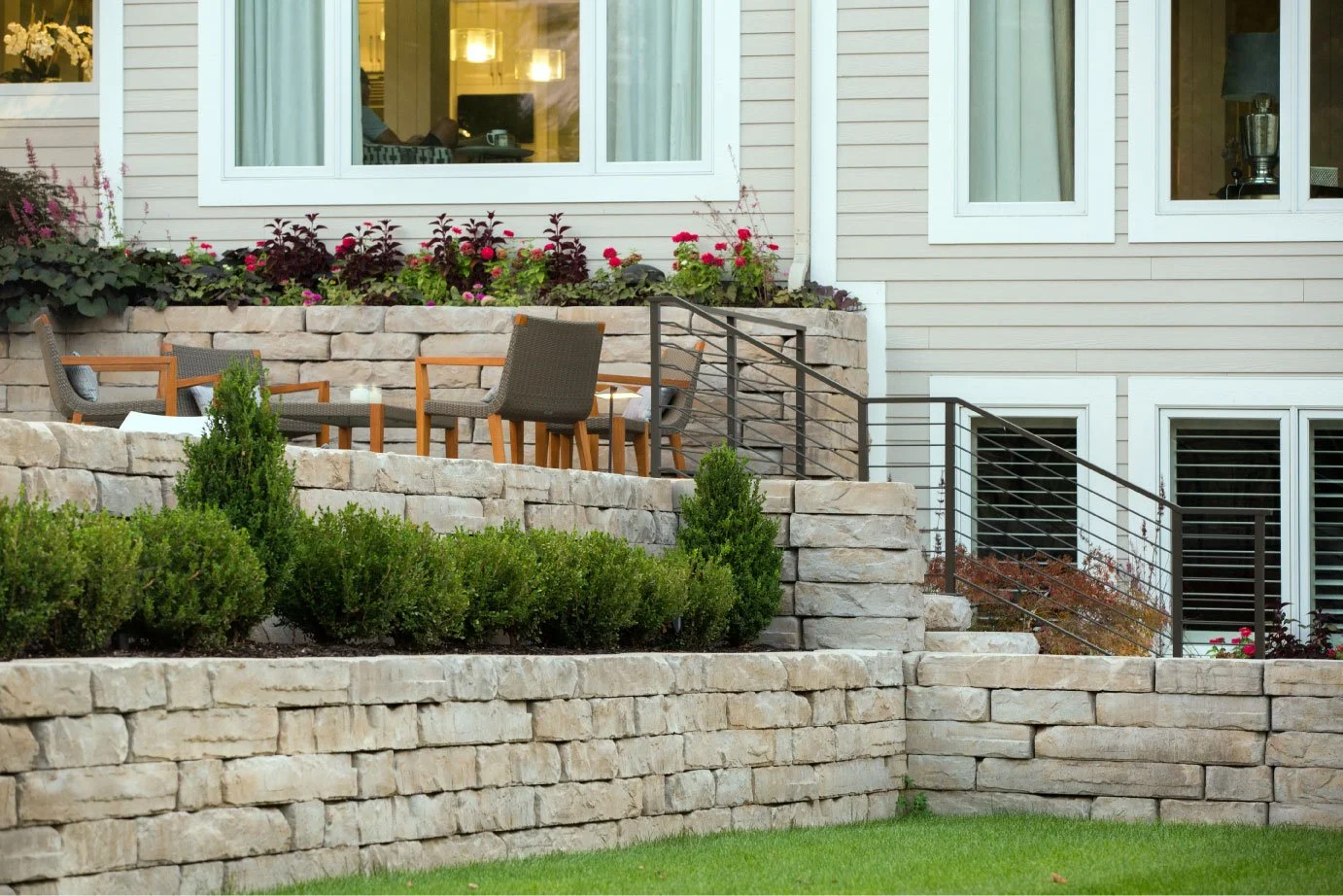 Kodah retaining wall, large-format snapped limestone blocks holding a steep grade change