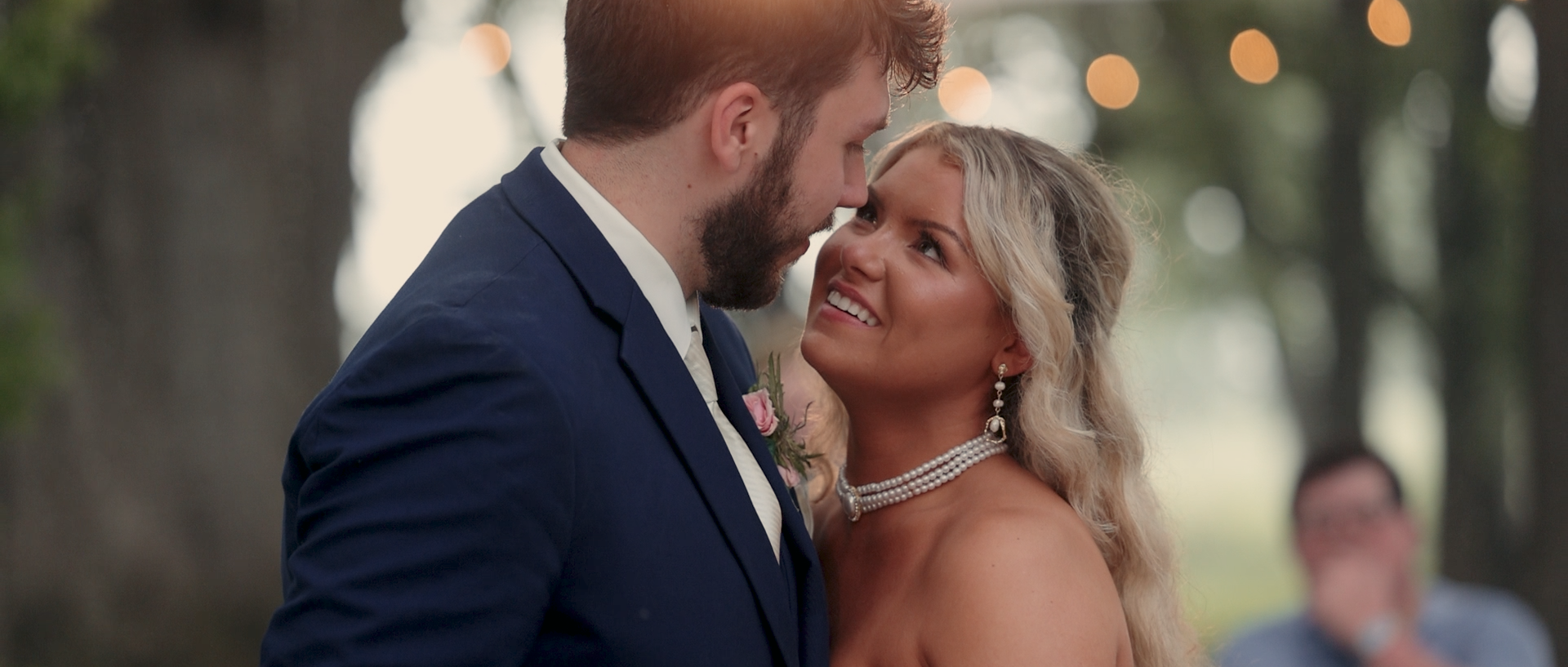 Newlyweds celebrating during a sparkler exit