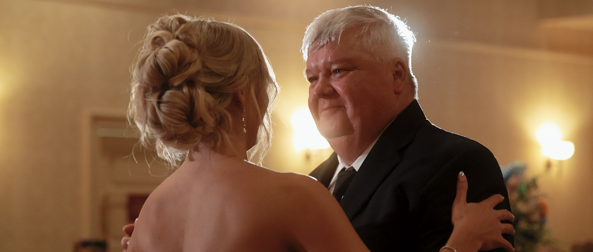A bride embracing a guest during her reception