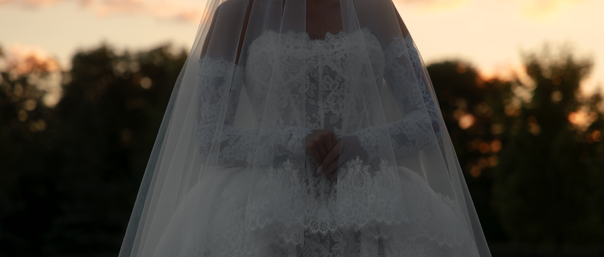 A bride looking at her partner during their outdoor ceremony