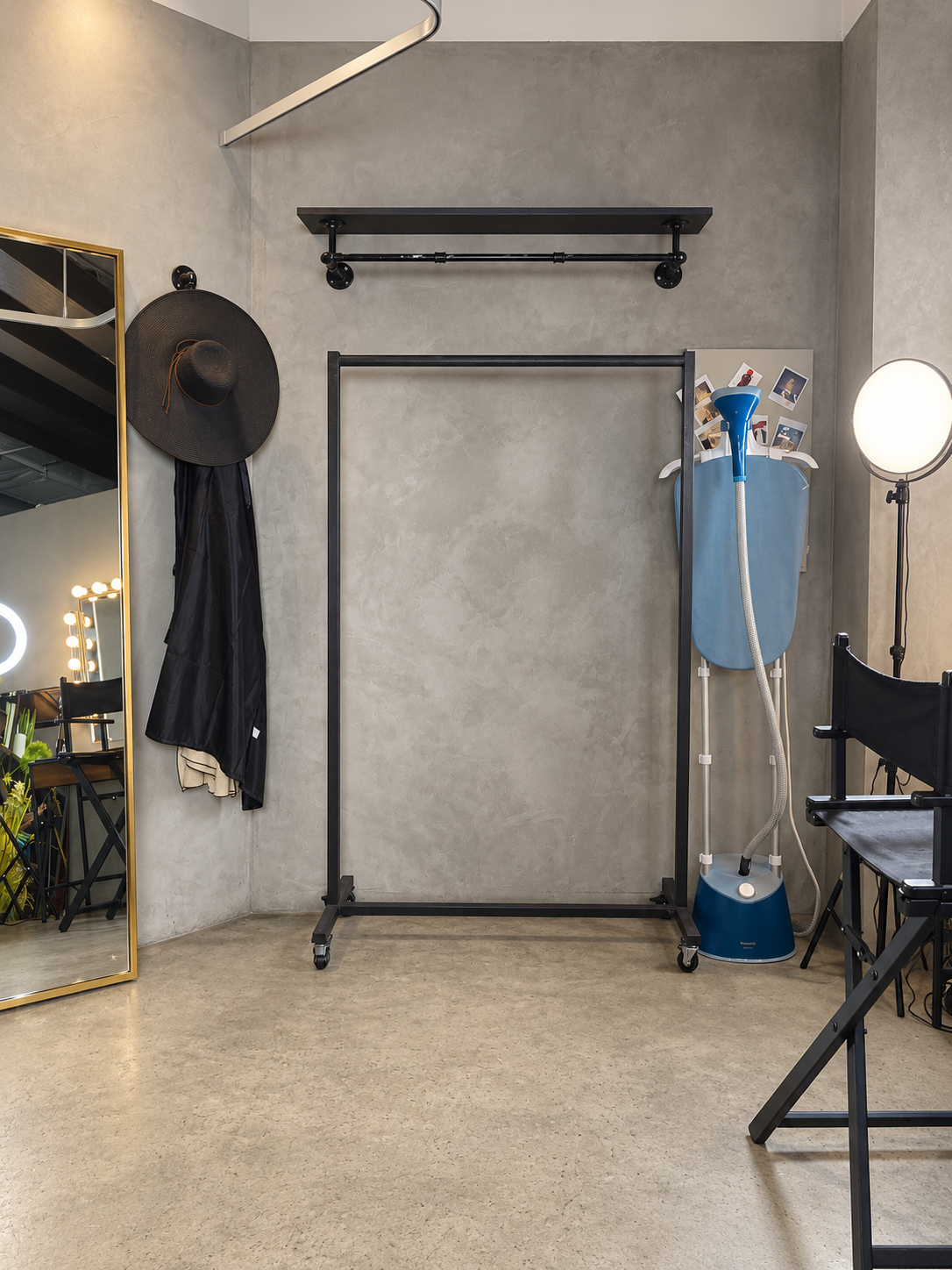Changing and wardrobe area with full-length mirror, clothes rail and steamer