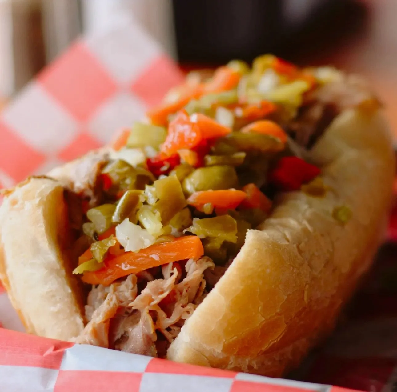 Chicago Beef Joint Italian beef sandwich topped with colorful giardiniera