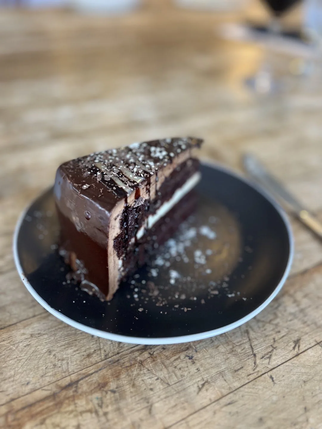 Chocolate layer cake with a dusting of sugar at Sandy Point Beach House in West Olive