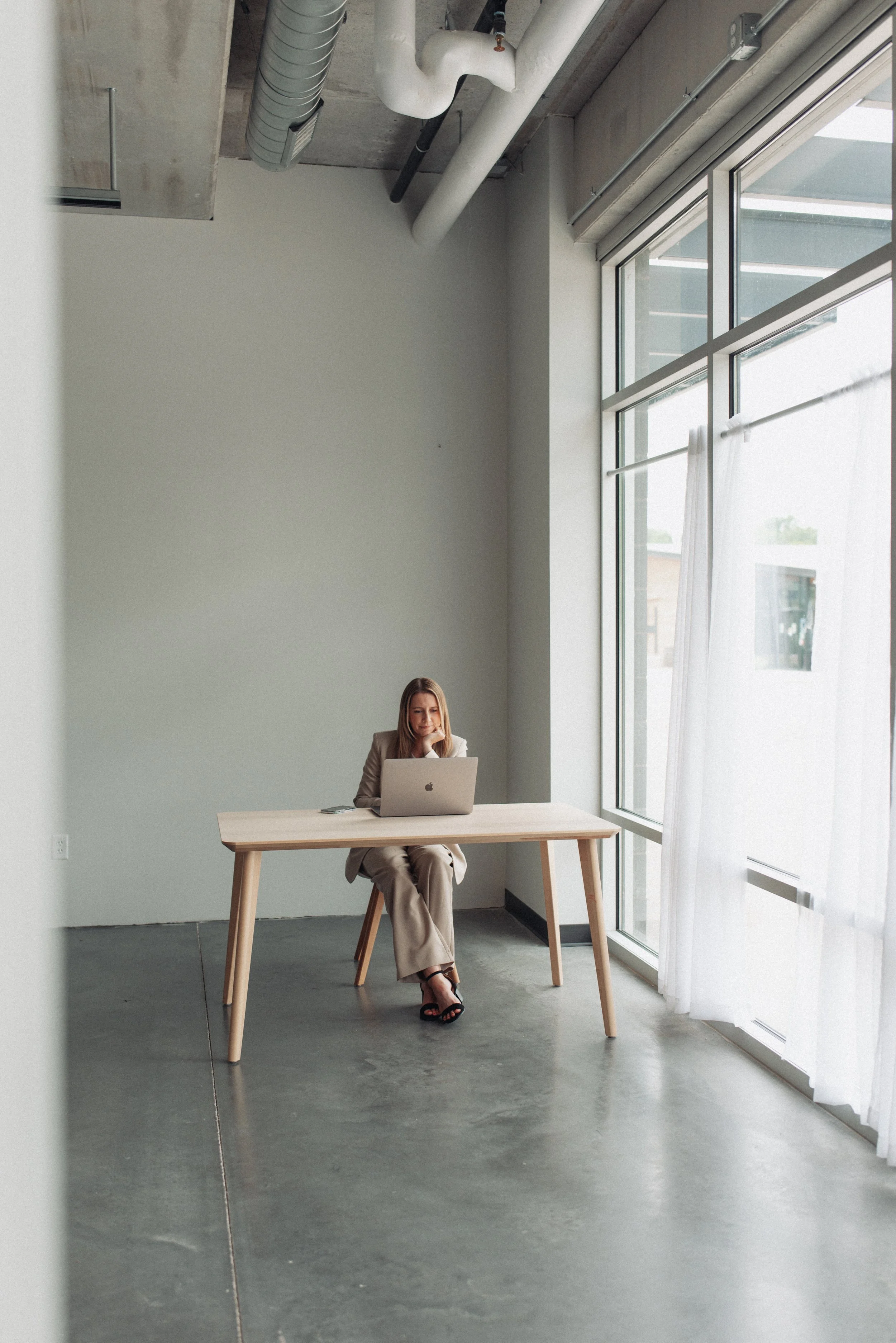 Ashley working at her desk