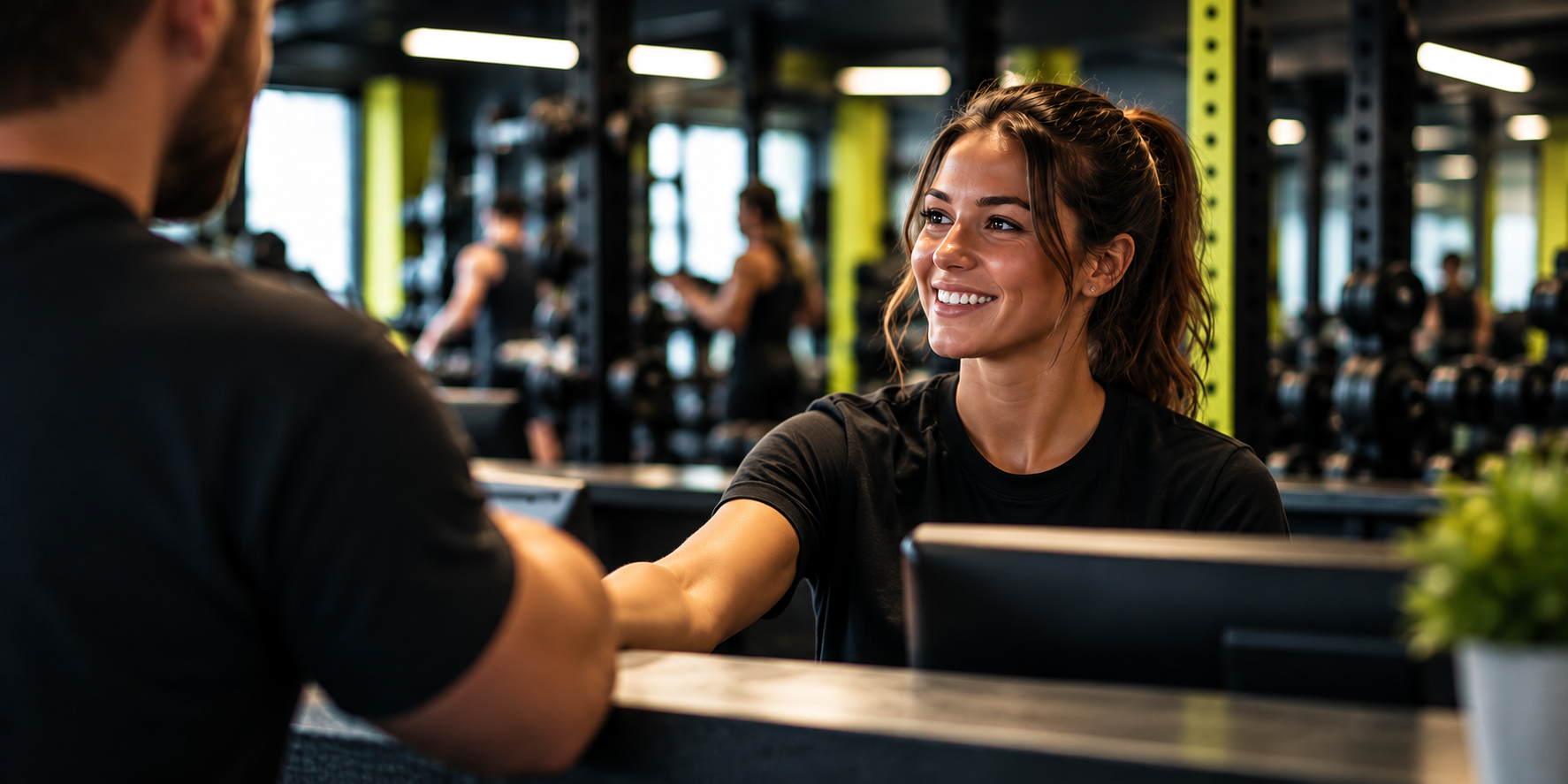 Front of House team member welcoming a member at DUAL Strength and Fitness in Horsham