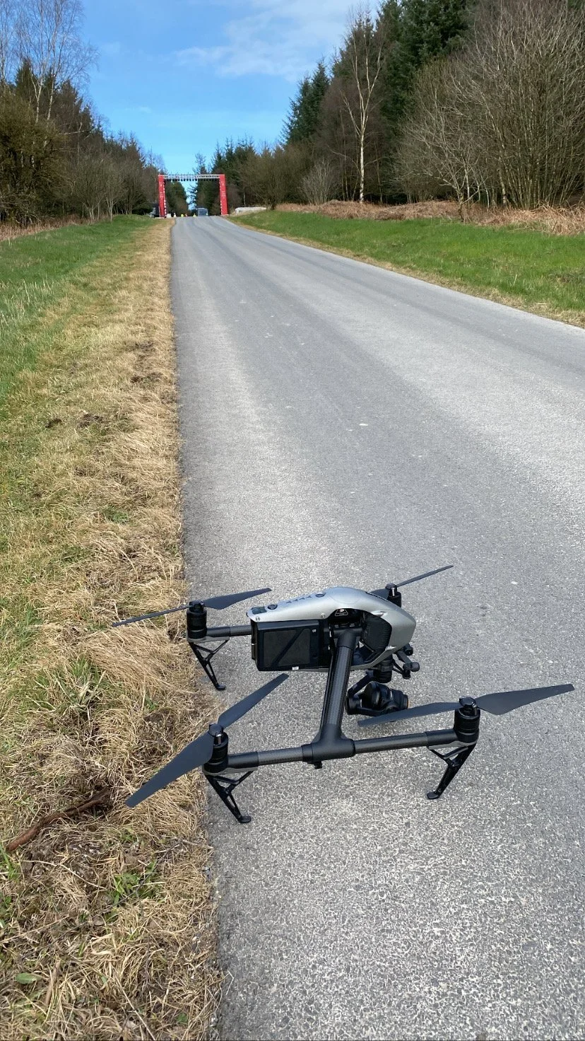 DJI Inspire 2 with Zenmuse X7 landed on a forest road before a car shoot