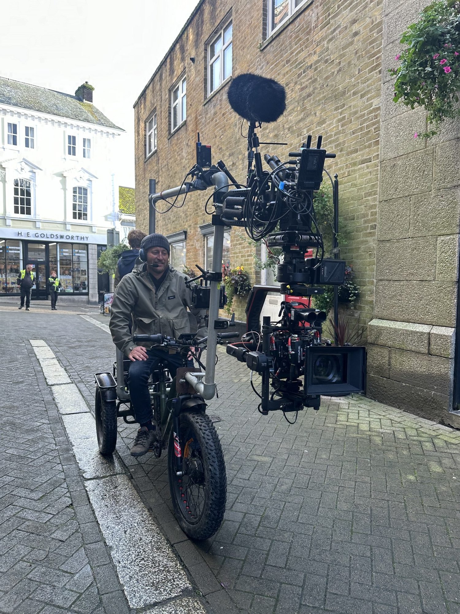 Electric Cine-Trike tracking with a heavy gimbal rig down a town street