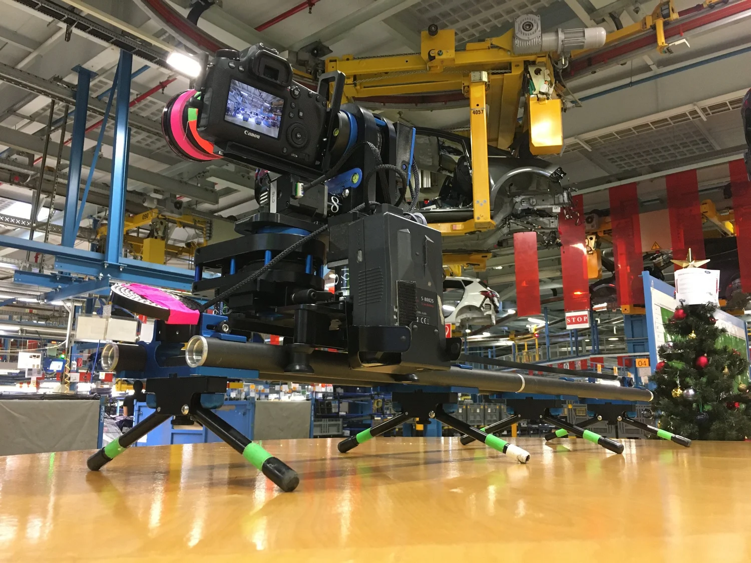 Motion control timelapse slider with a Canon on a two-axis head, set low on location