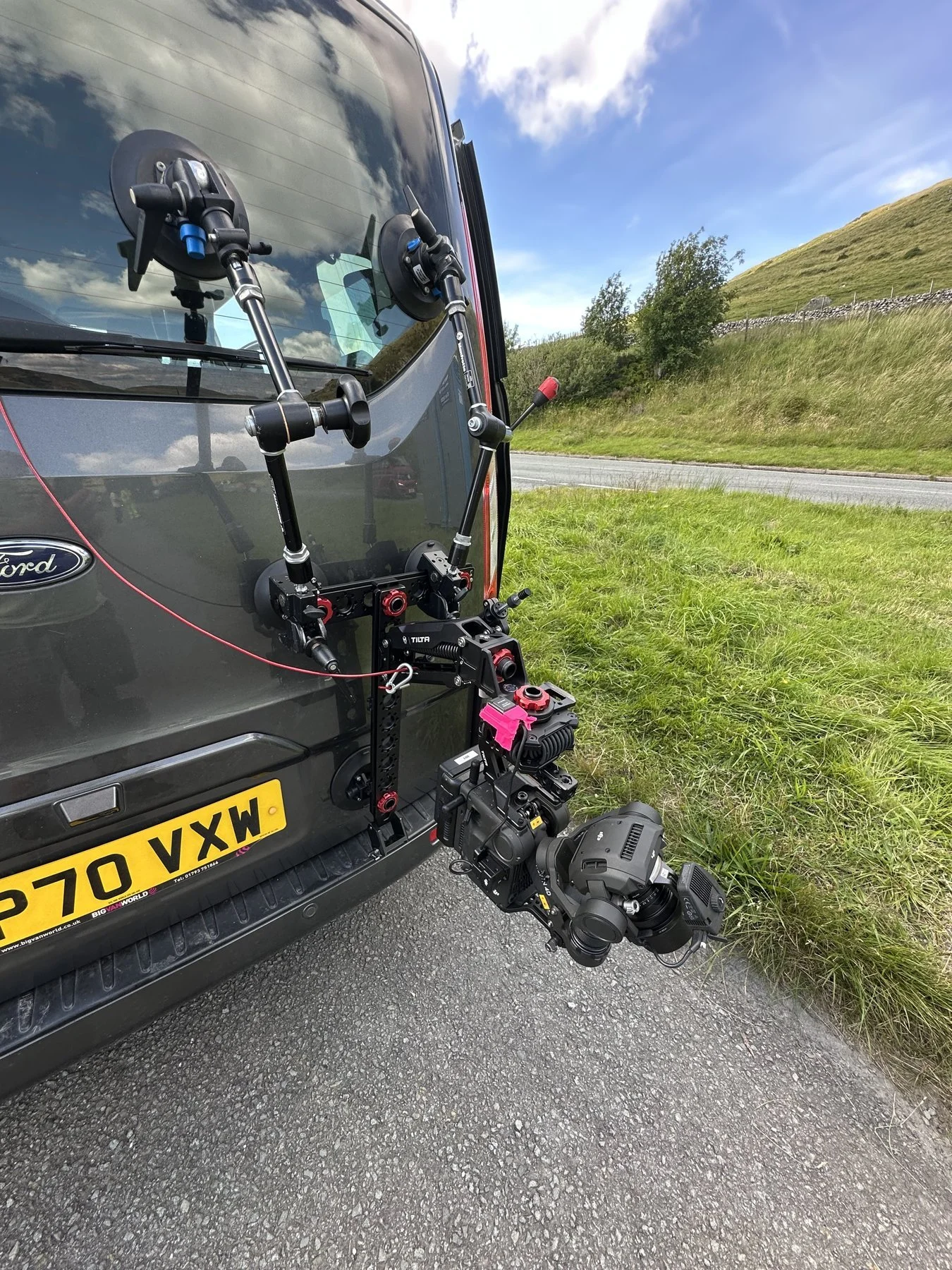 Gimbal and cinema camera mounted to a car with a suction rig