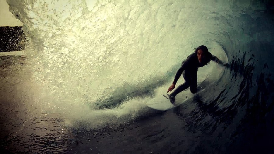 Surfer in the tube, filmed from the water
