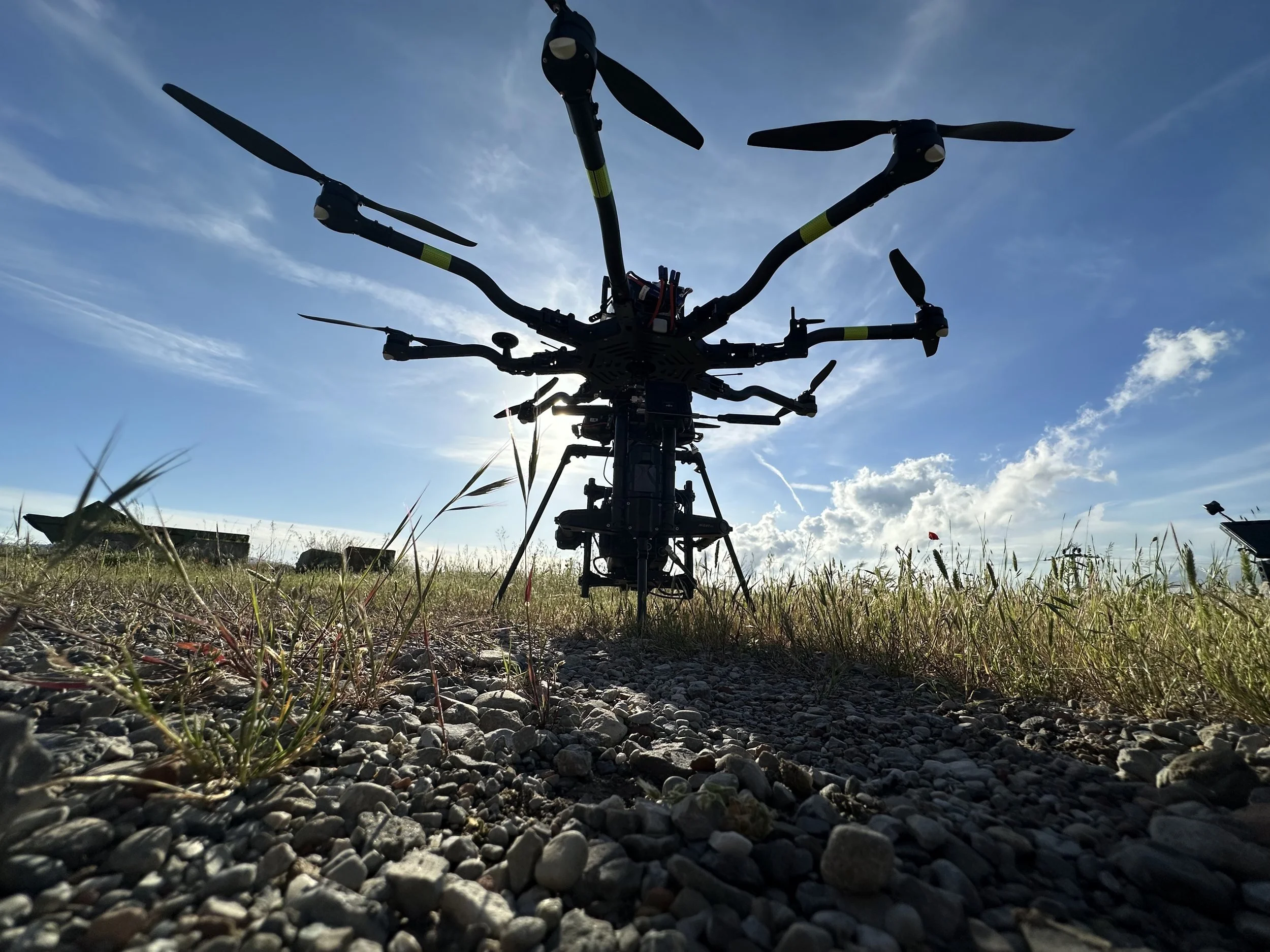 Freefly Alta 8 heavy-lift cinema drone silhouetted against the sky on location