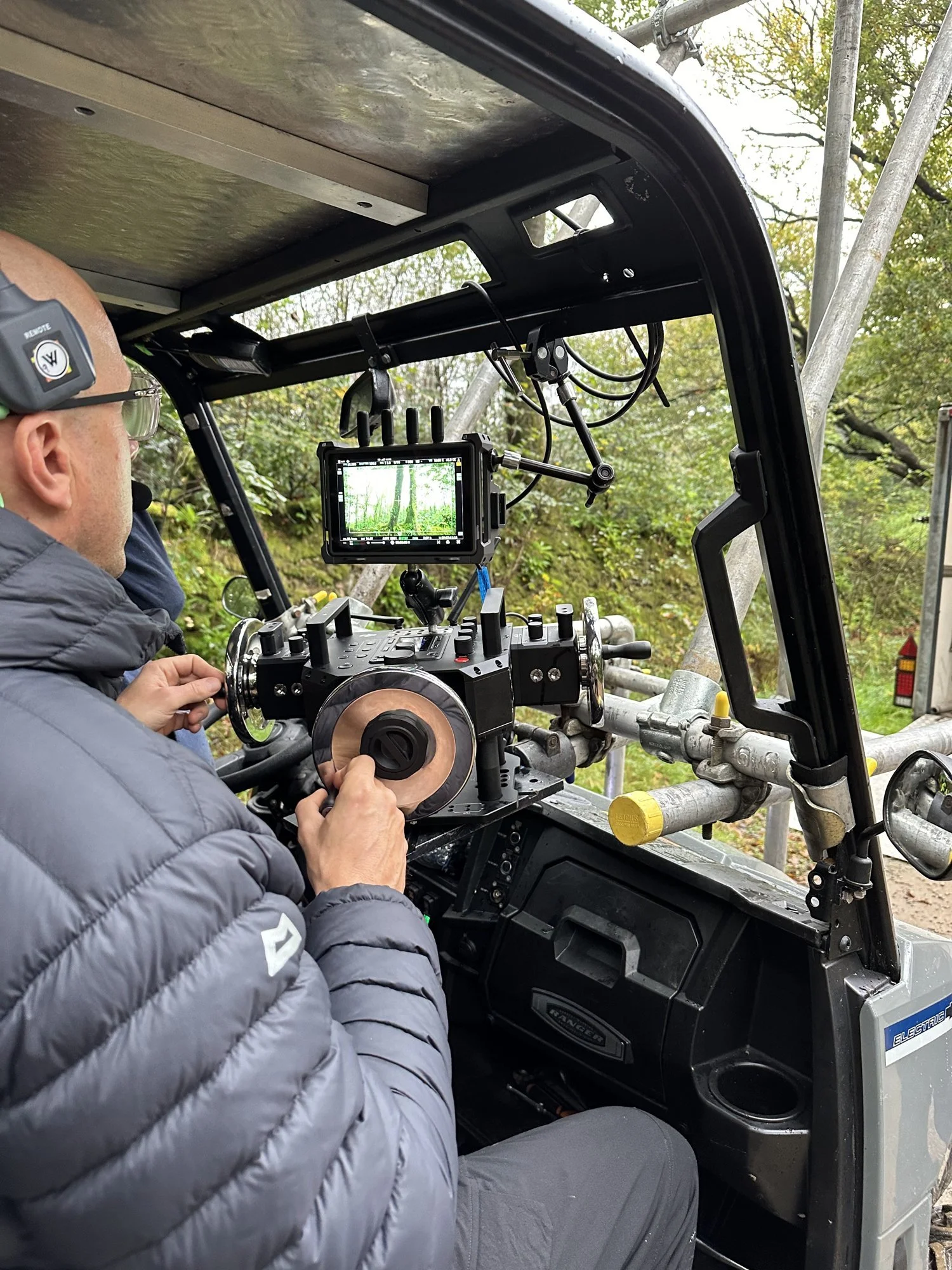 Gimbal operator on remote wheels inside a tracking vehicle