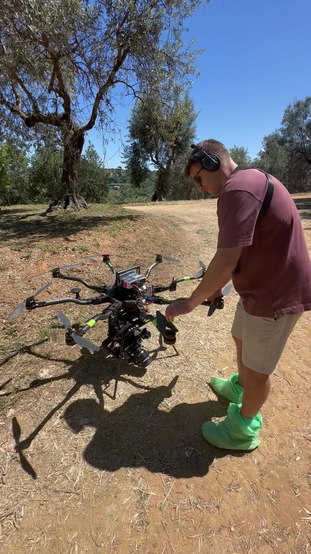 Pre-flight checks on the Alta 8 and its custom Movi Pro under olive trees