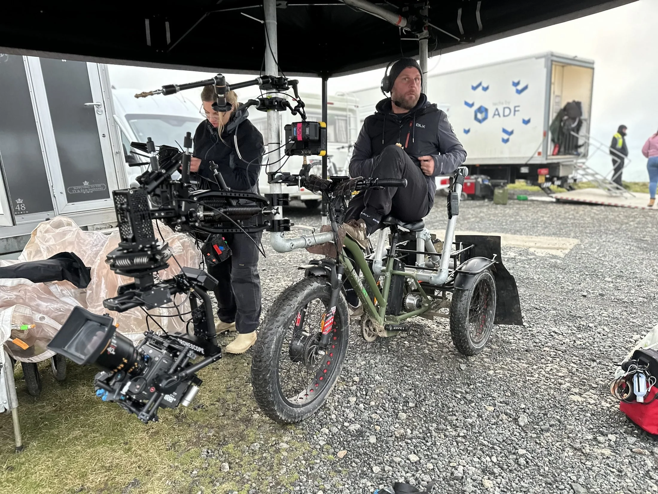 Cine-trike and camera crew preparing a heavy rig on location