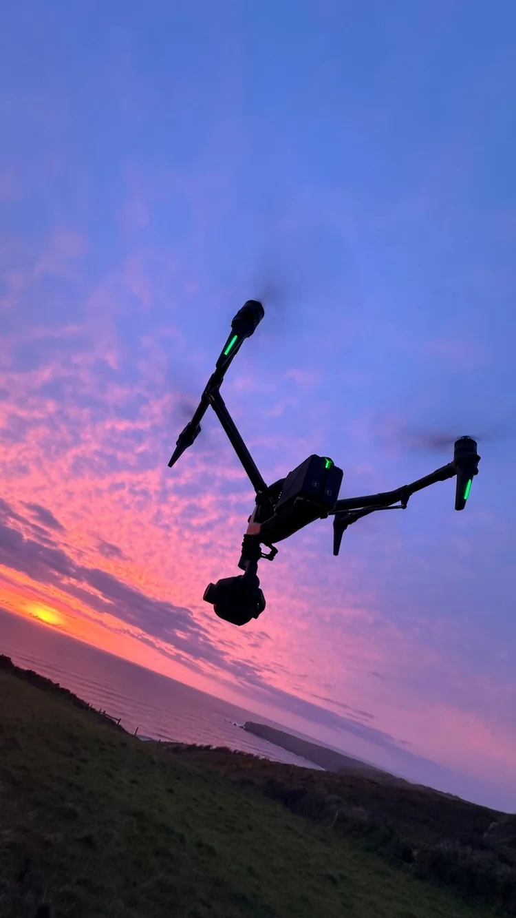 DJI Inspire 3 in flight at sunset