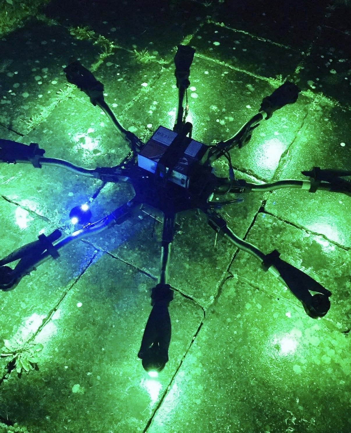 Heavy-lift Alta drone with its LED light glowing at night