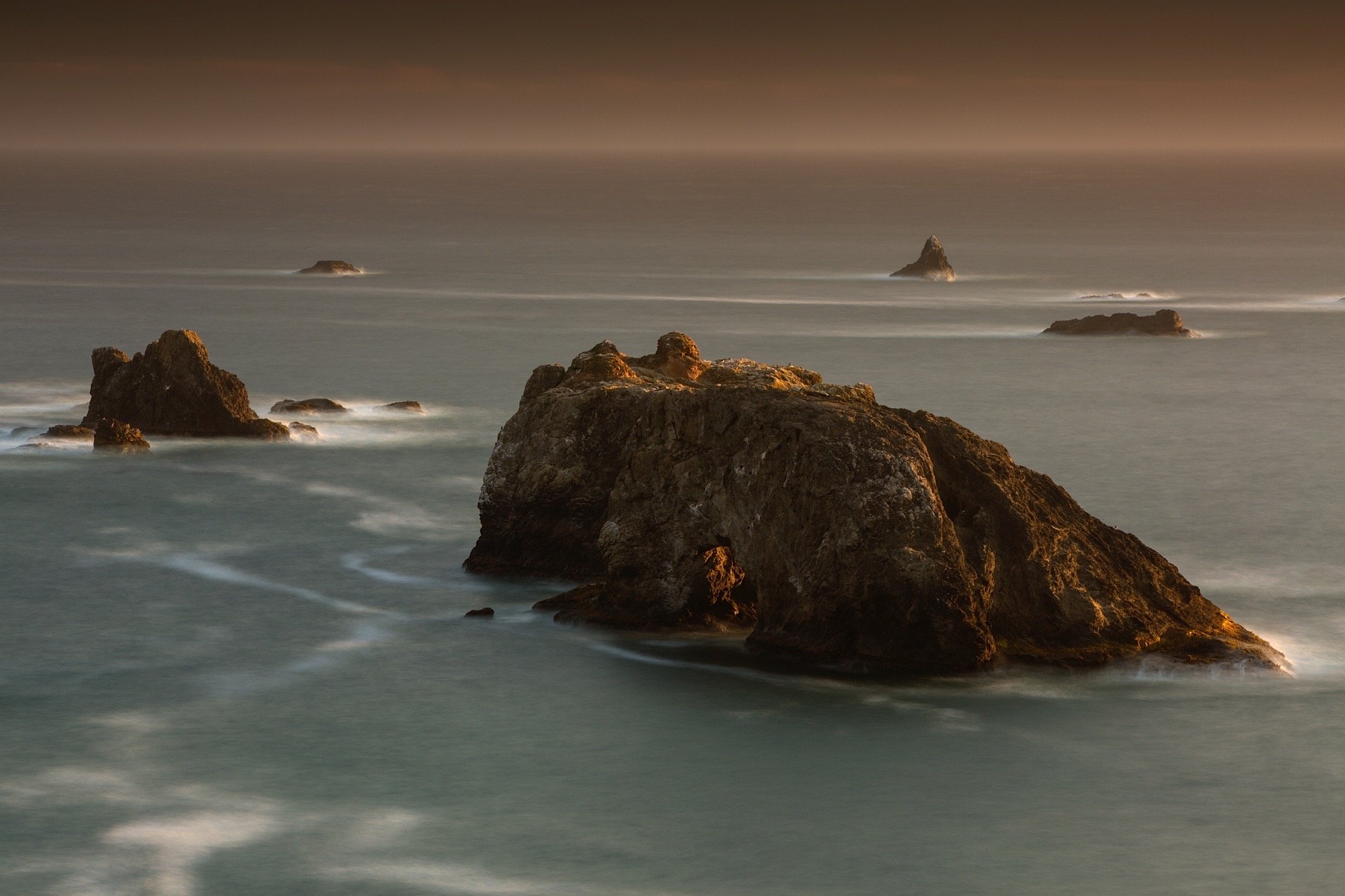 Placeholder for panoramic photograph of Oregon's rugged Pacific coastline