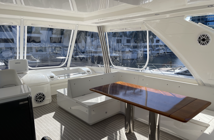 custom enclosure system on motor yacht in South Florida marina custom enclosure system on motor yacht in South Florida marina