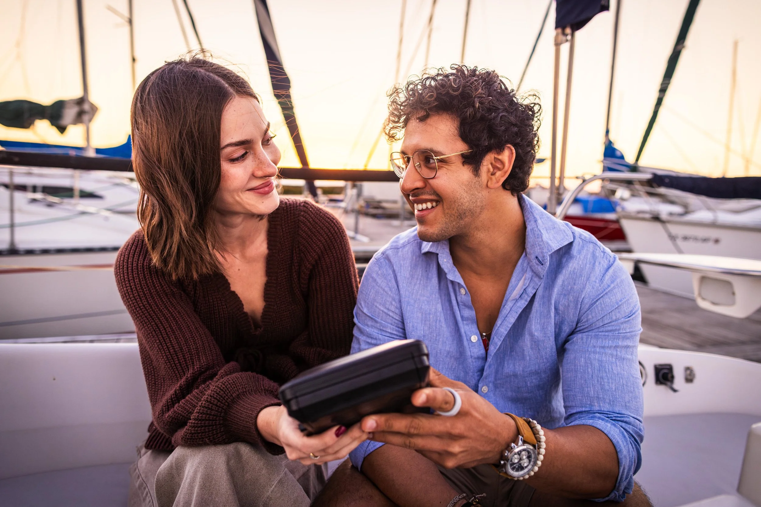 Nicole Alston and Xavier Alexander on the sailboat with the tape recorder