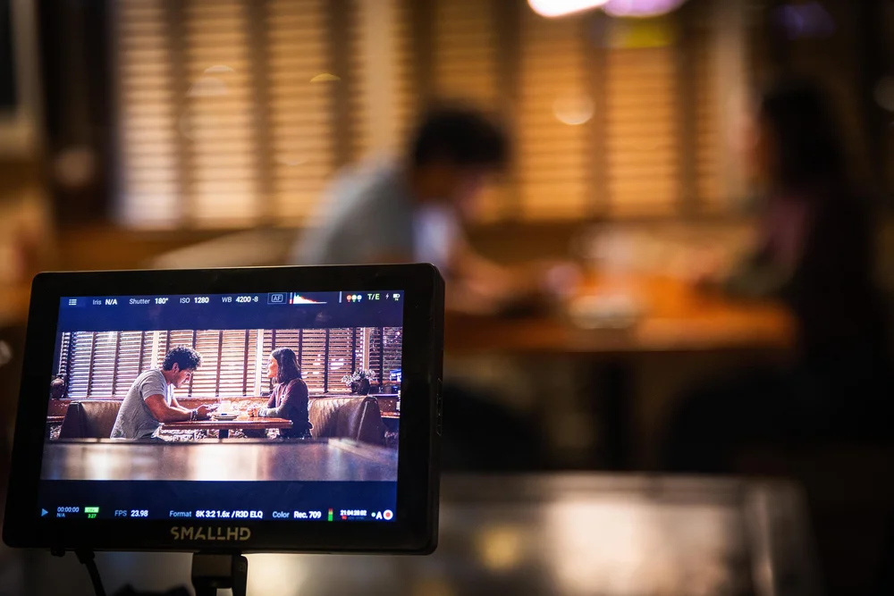 On set at OPA! Greek Taverna: the monitor during the booth scene