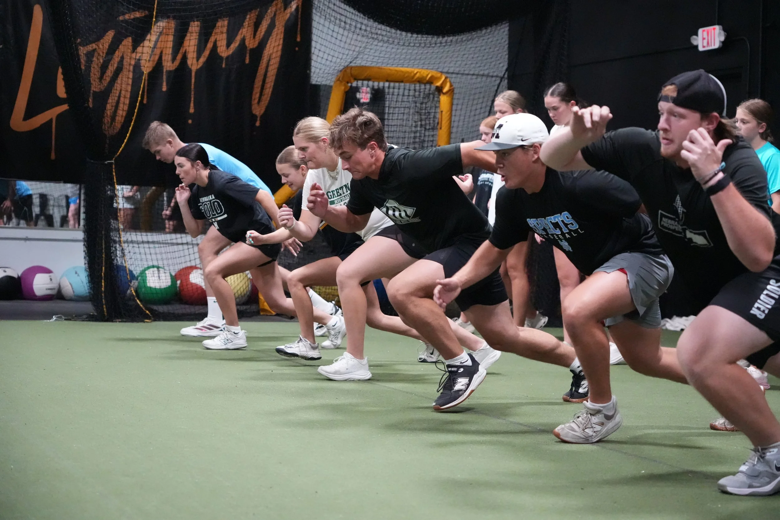 Loyalty athletes exploding out of a sprint start