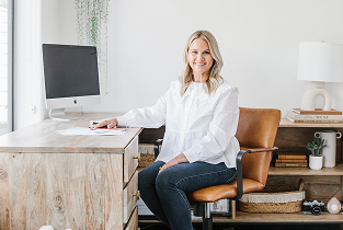 Chelsea sitting at desk