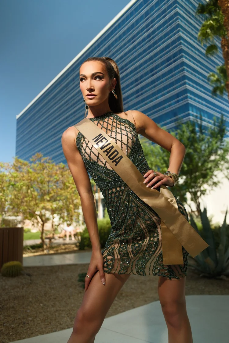 Pageant contestant posing in an emerald gown