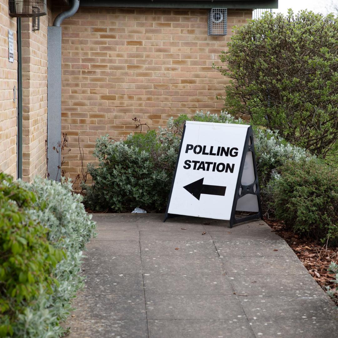 White foam board saying Polling Station