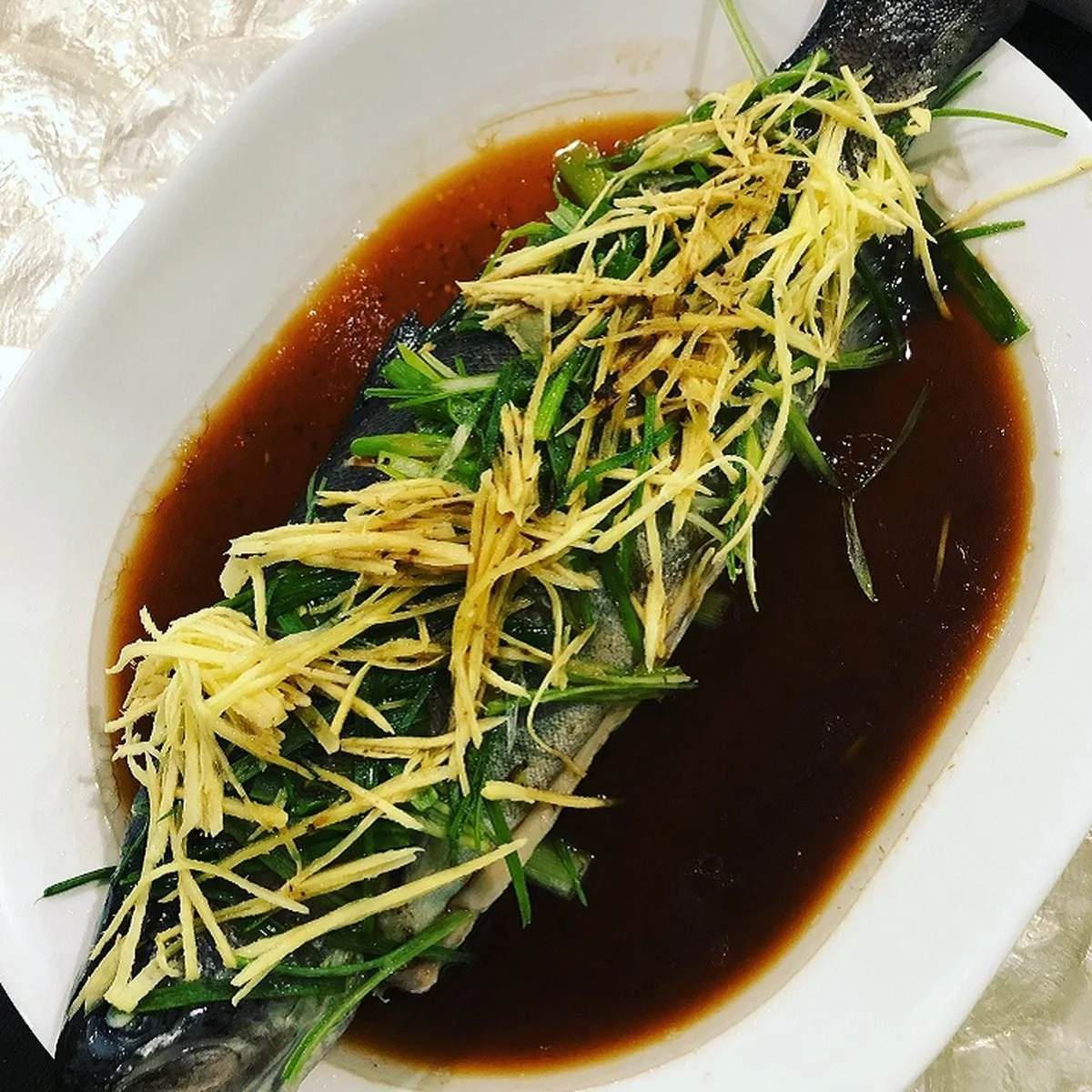 Steamed whole fish with ginger and scallion, taught in private cooking lessons at Dash of Soy