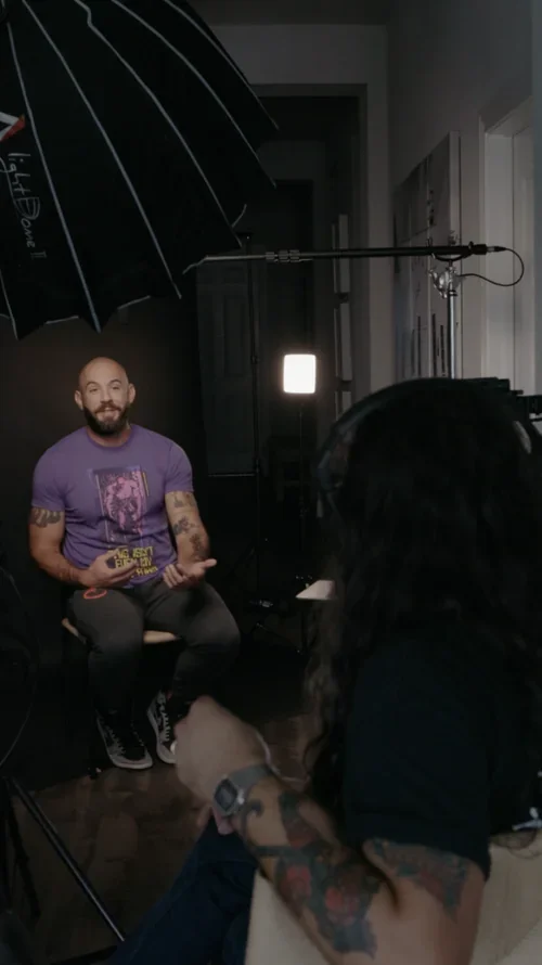 Interview subject seated on a Story Media Co. video production set