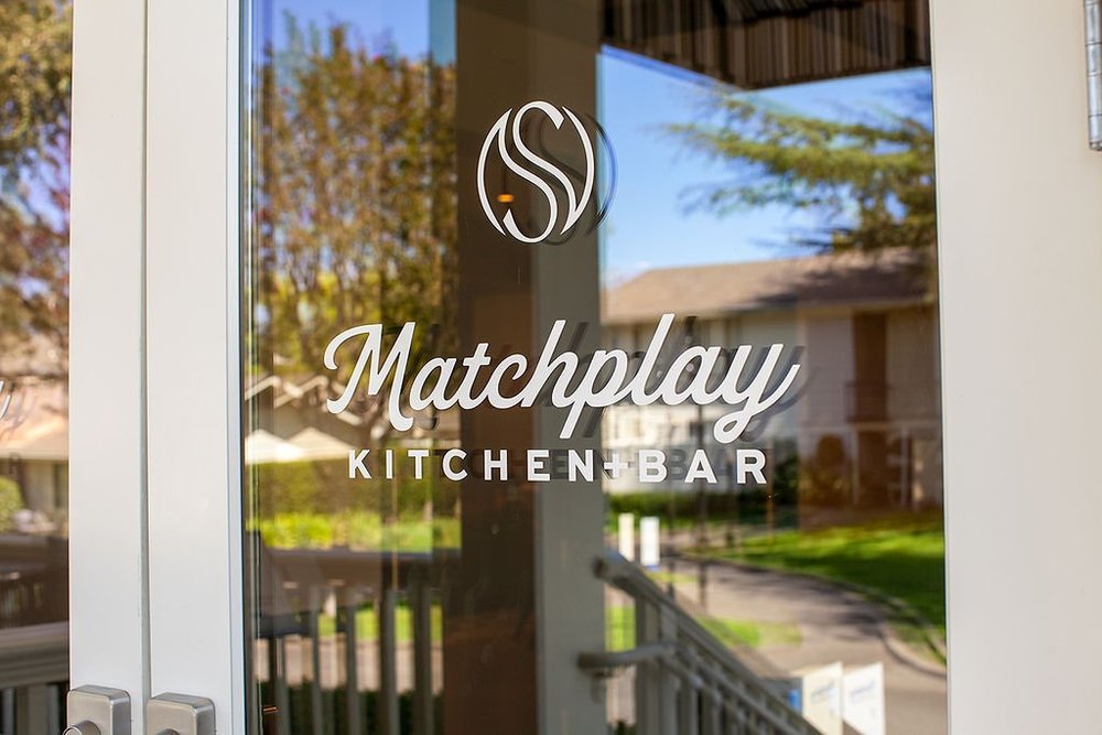 Matchplay Kitchen and Bar signage etched on the restaurant entrance