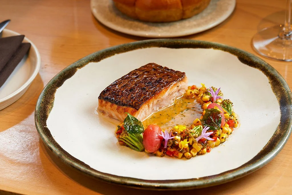 Binchotan-grilled Kvarøy Arctic salmon with charred corn succotash and tomato beurre blanc
