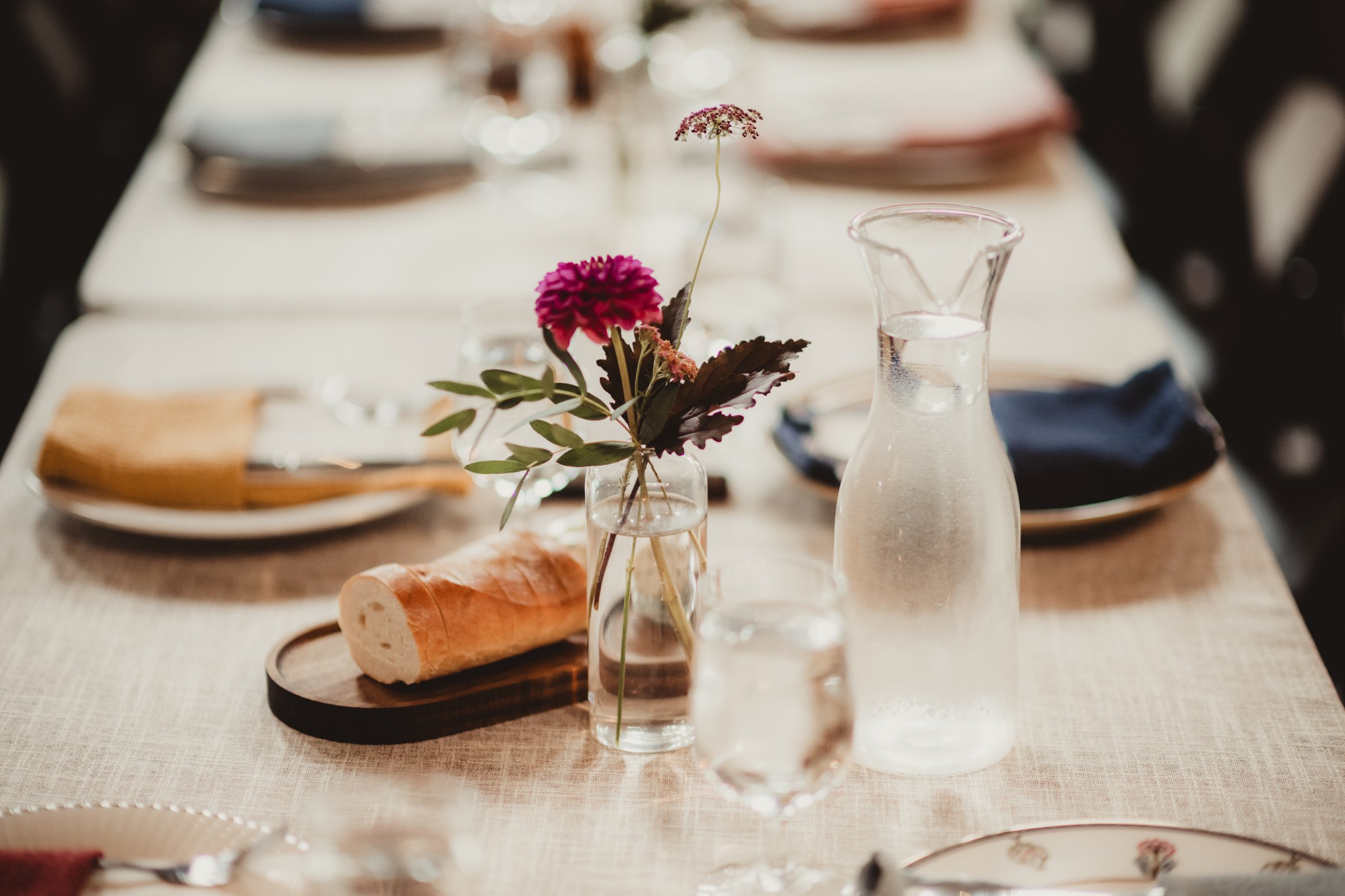 A bread service and place setting composed for a commissioned wedding menu