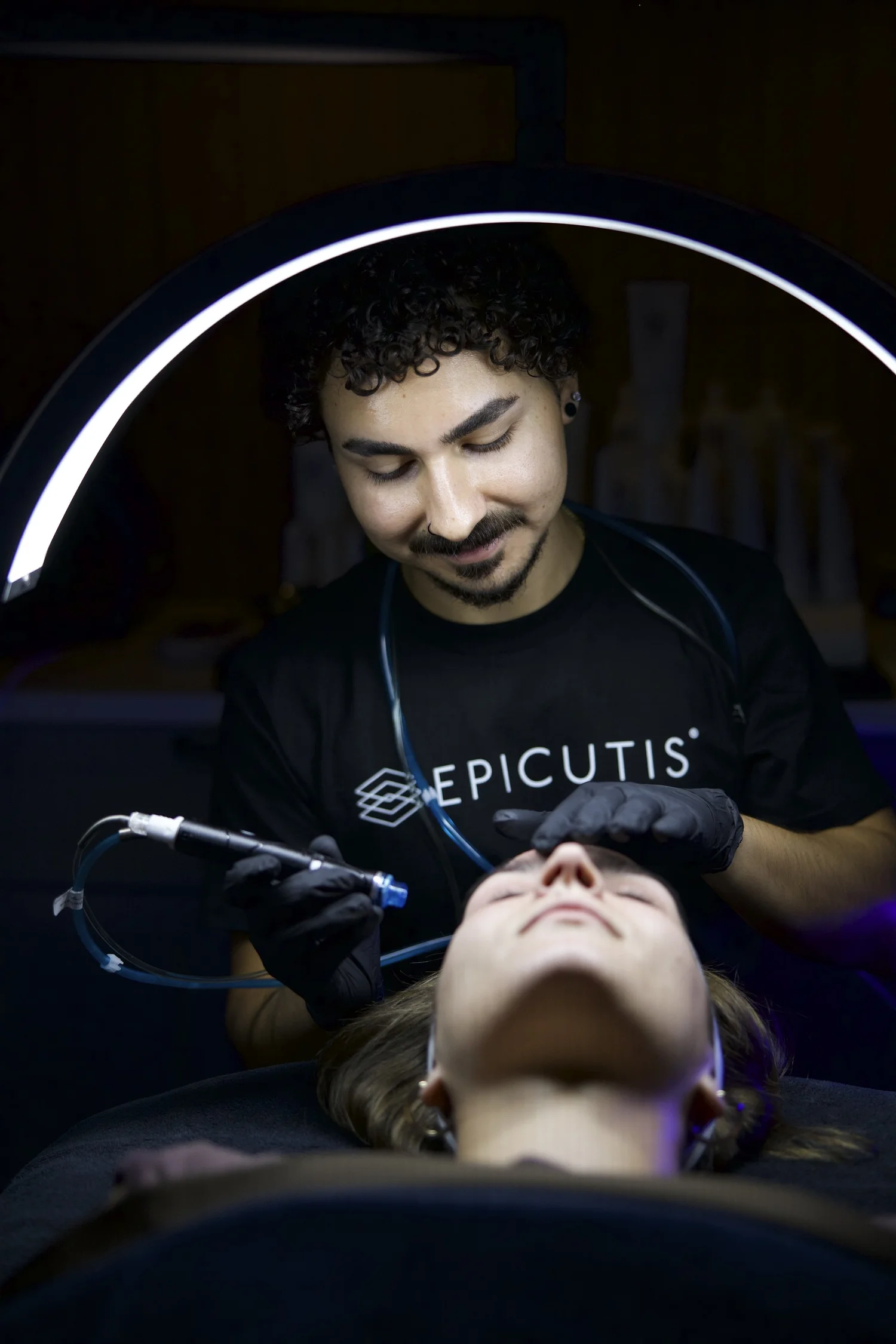 Joshua performing a Hydrafacial treatment at The Face Space
