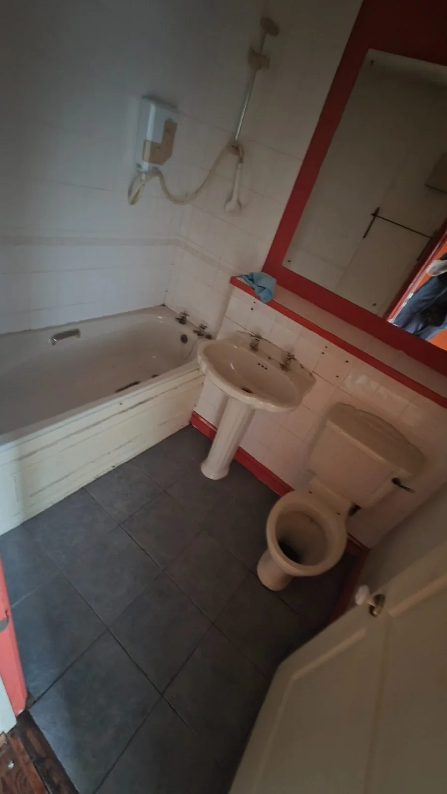 The same bathroom after a full biohazard deep clean, cleared and sanitised