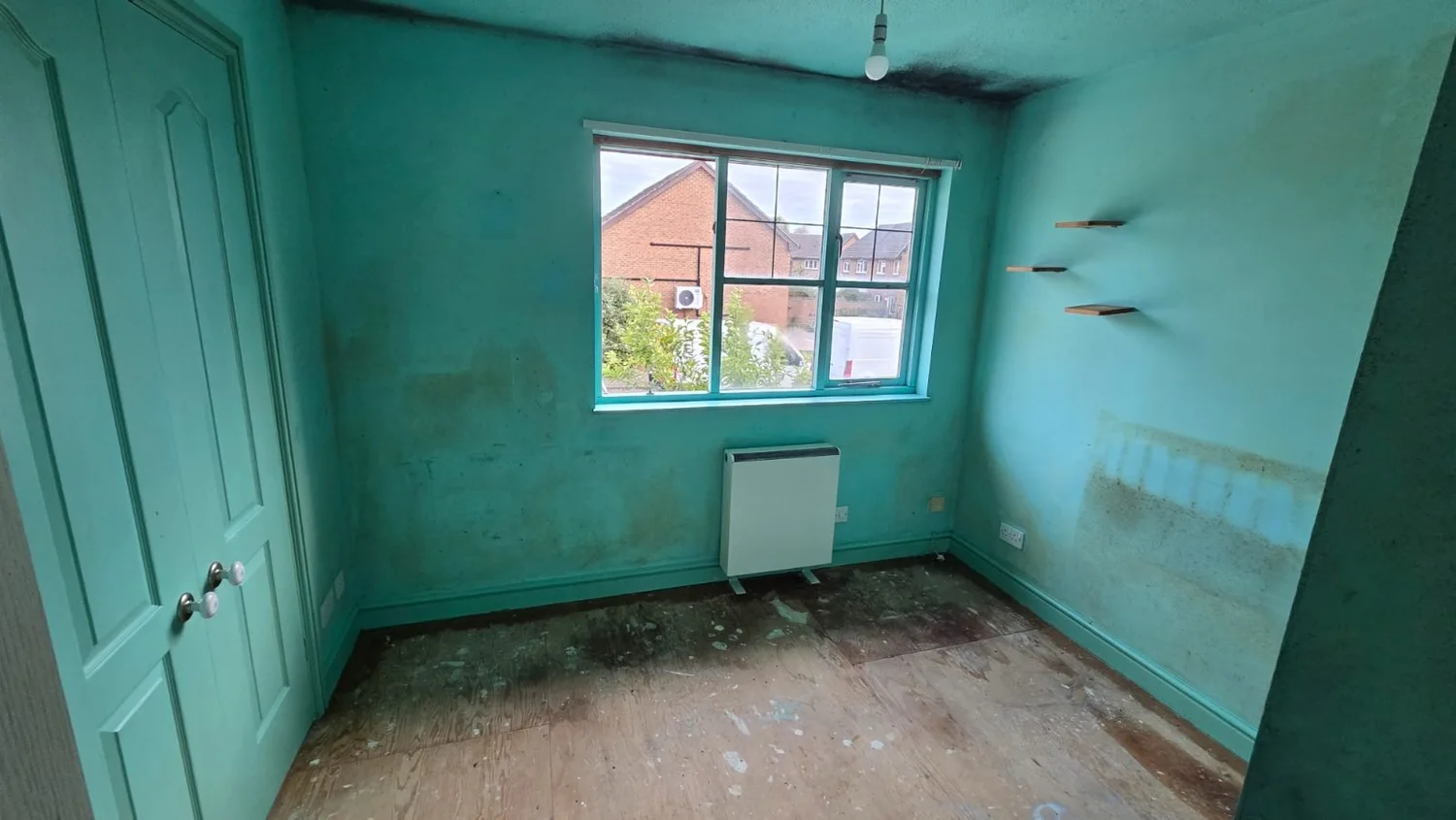 The same bedroom after clearance, cleared to the floor and made safe