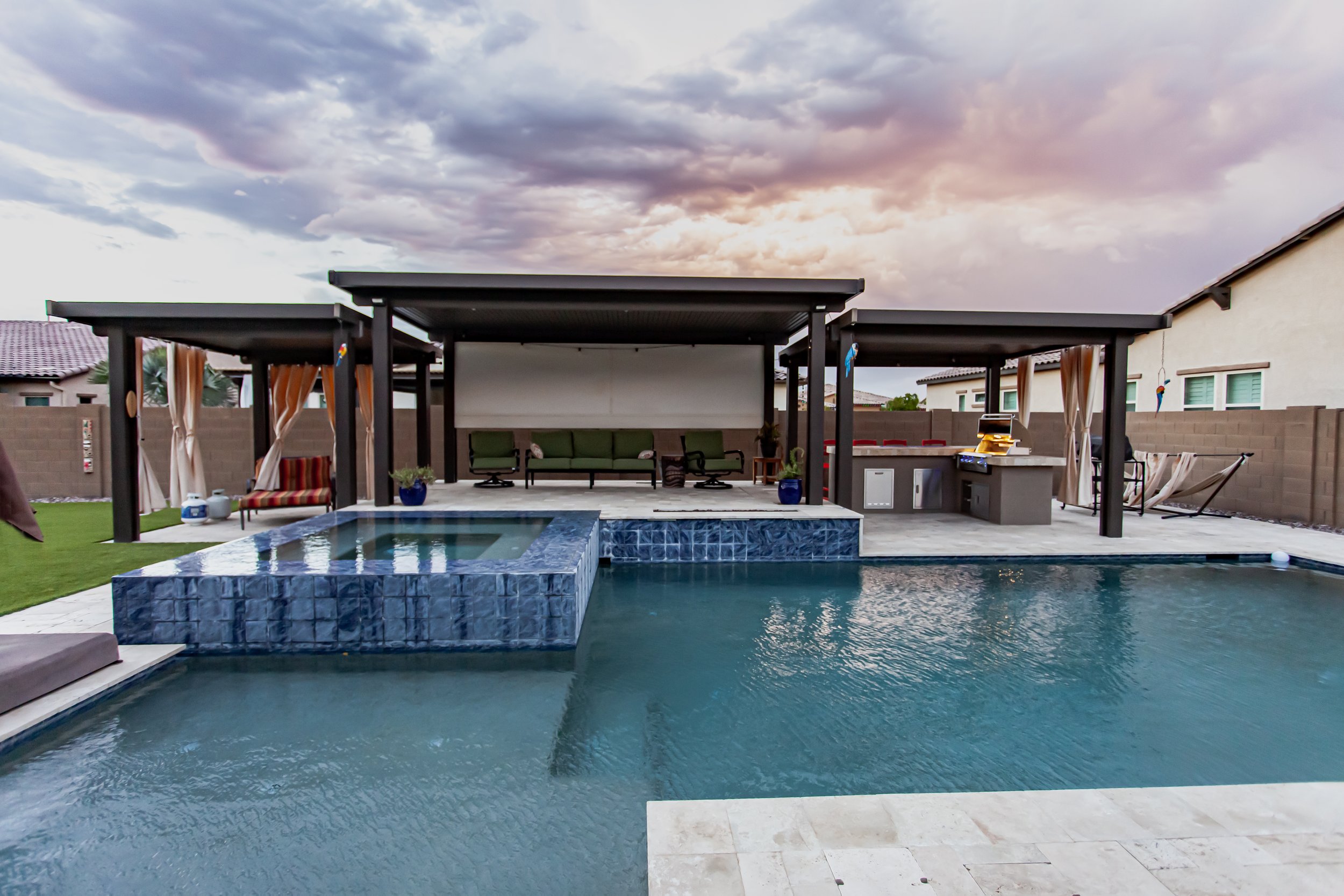 Paver patio with outdoor kitchen and seating area