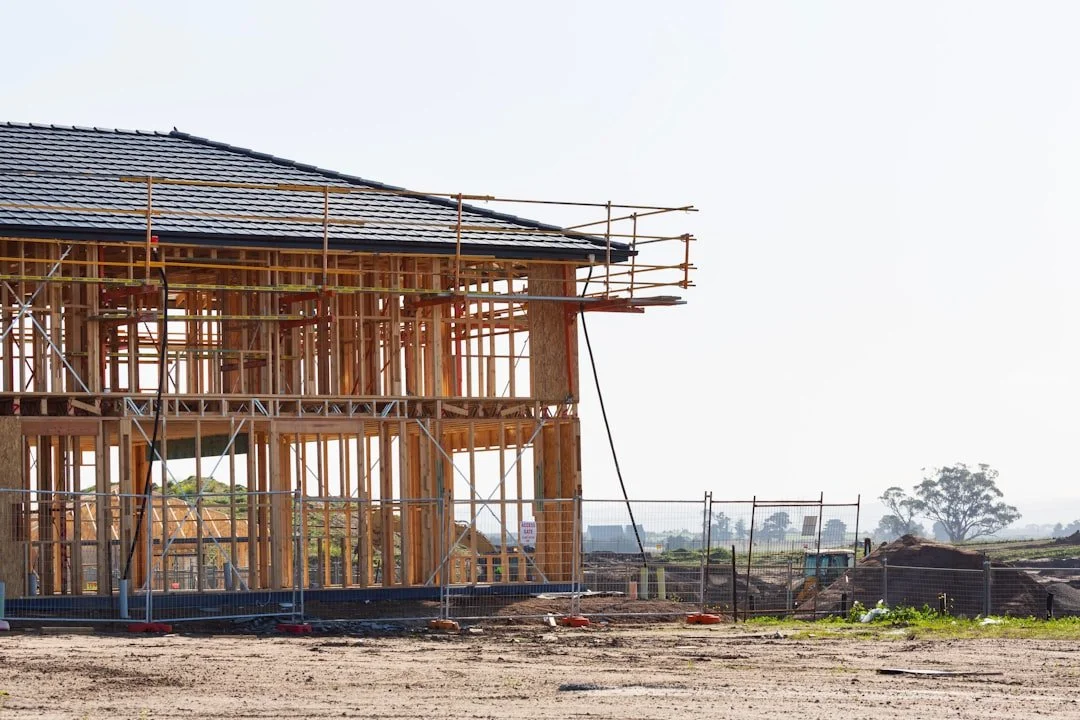 Wood framed new construction home before drywall, ready for smart home pre-wire planning | VIP Smart Homes Seattle