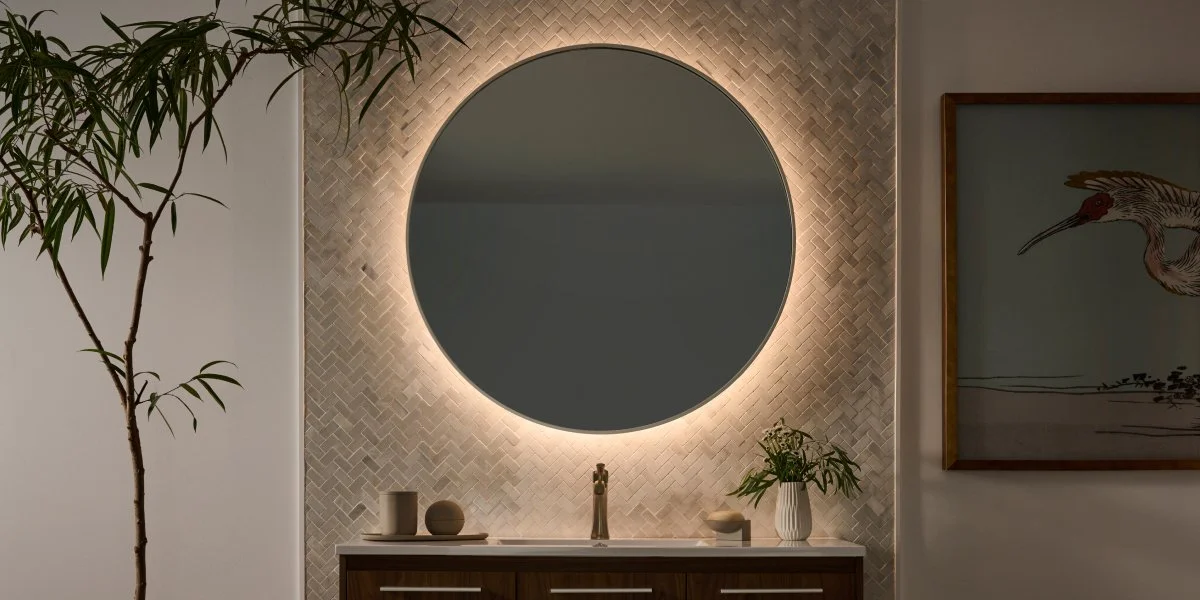 Lutron Lumaris RGB plus tunable white tape light installed behind luxury bathroom vanity mirror | VIP Smart Homes Seattle