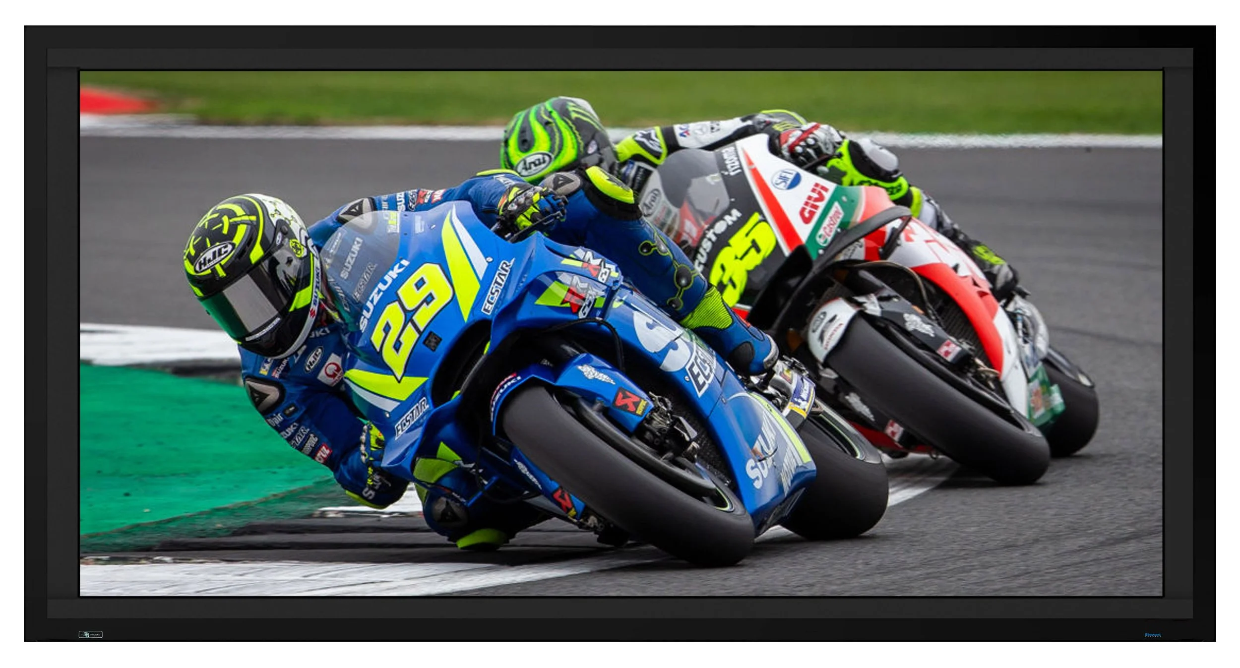 Stewart Filmscreen Director's Choice EVO screen displaying a saturated motorsport broadcast at speed