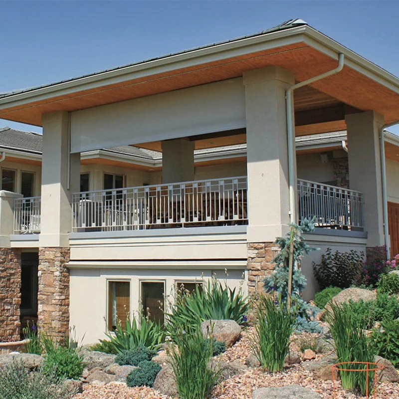 Lutron motorized outdoor shades and screens on covered patio reducing glare and extending Lutron control system to exterior living spaces