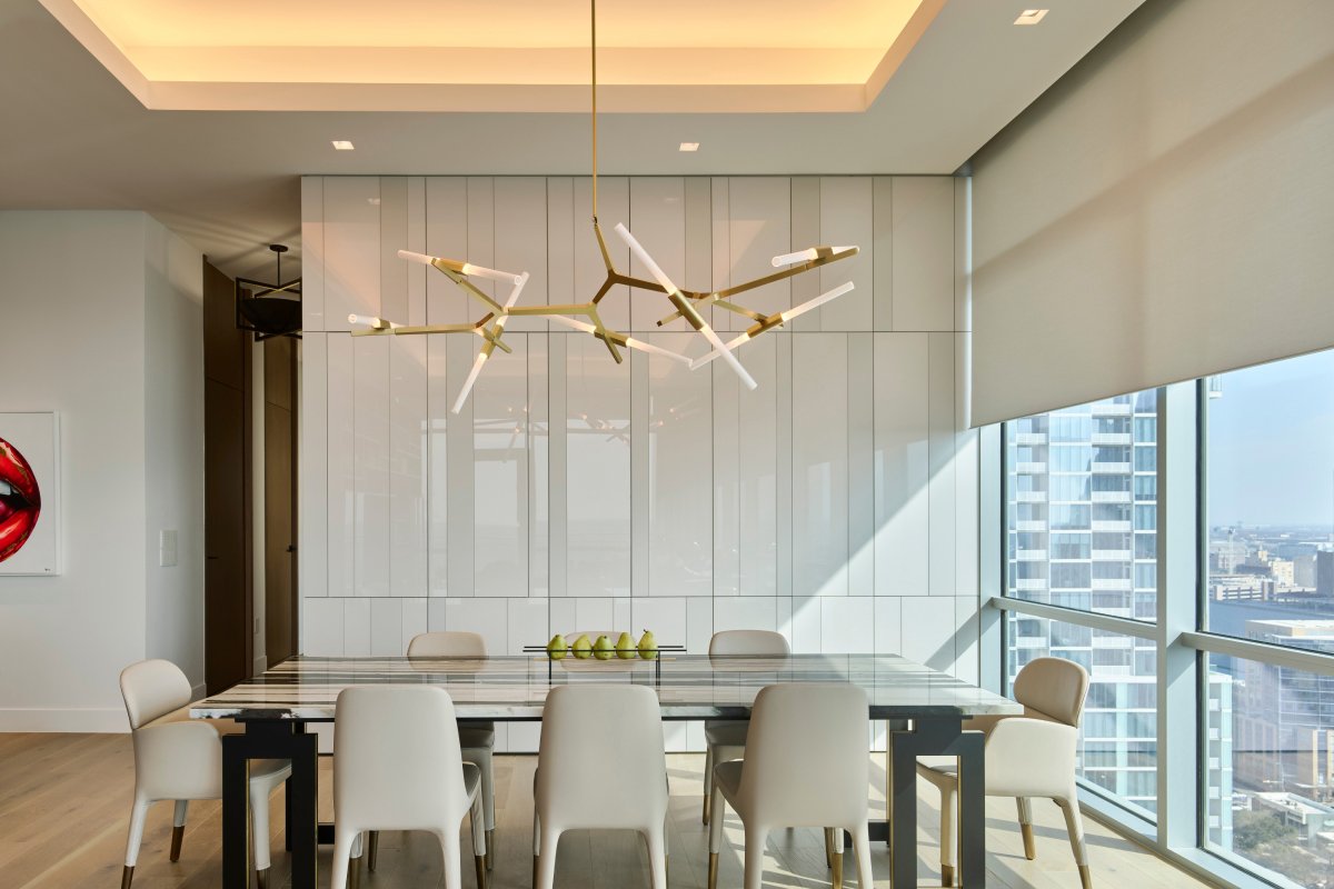 Lutron Ketra natural daylight in luxury dining room with gold sputnik chandelier and marble table | VIP Smart Homes Seattle