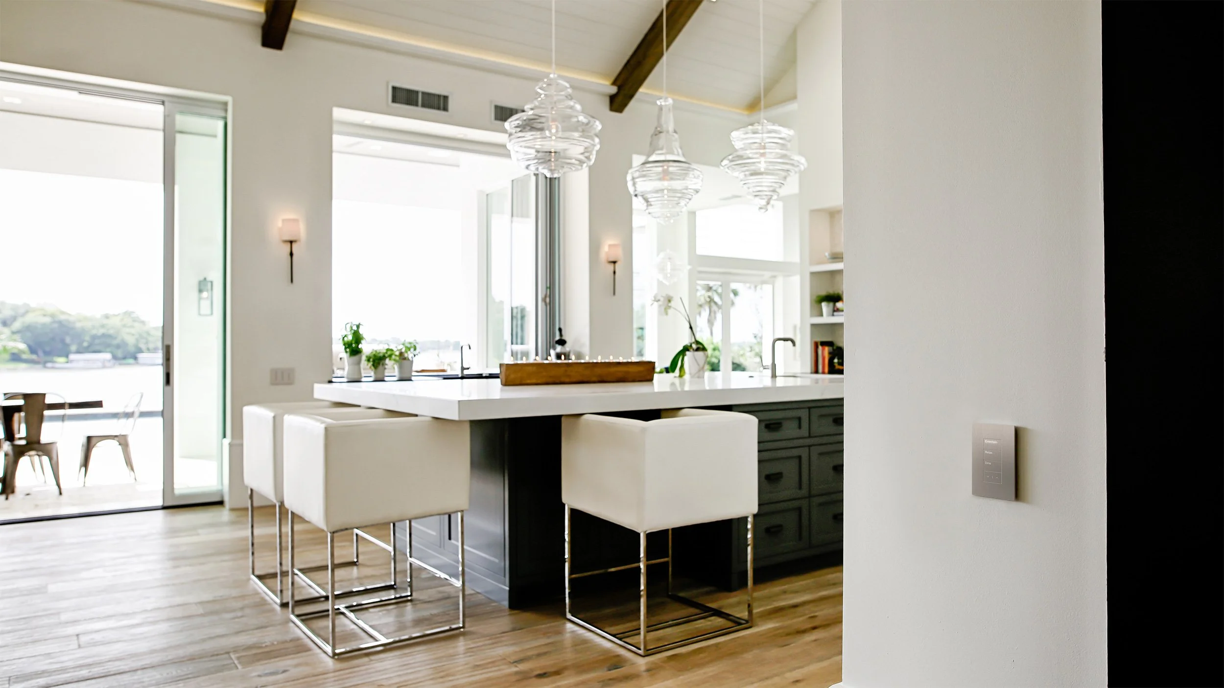 Lutron Palladiom Architectural Keypad in Modern Lakefront Kitchen with Engraved Entertain Relax Dine Buttons | VIP Smart Homes Seattle Bellevue Eastside