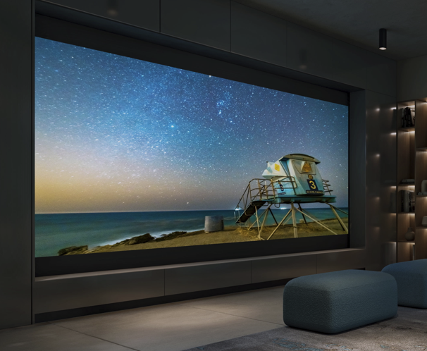Ultra short throw 4K RGB triple laser projector casting 150 inch image onto ambient light rejecting screen in luxury media room | VIP Smart Homes Bellevue