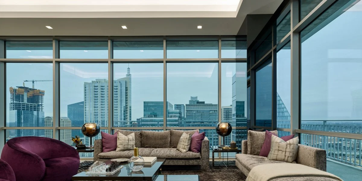 Lutron Ketra cool daytime natural spectrum light in luxury high rise living room with city view | VIP Smart Homes Seattle